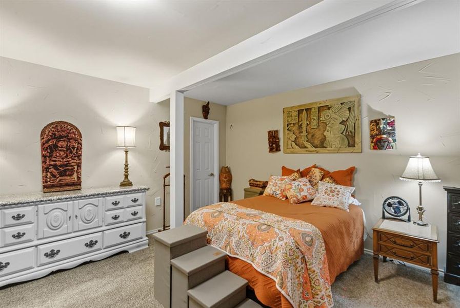 Bedroom featuring light carpet Bedroom featuring light carpet