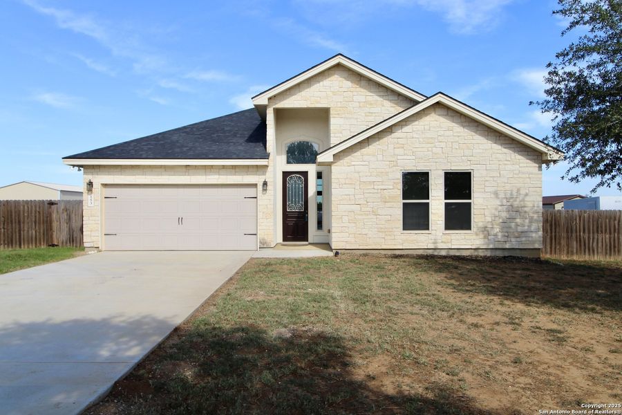 Front exterior of a new home in , Lytle, TX, highlighting curb appeal (Image 18).