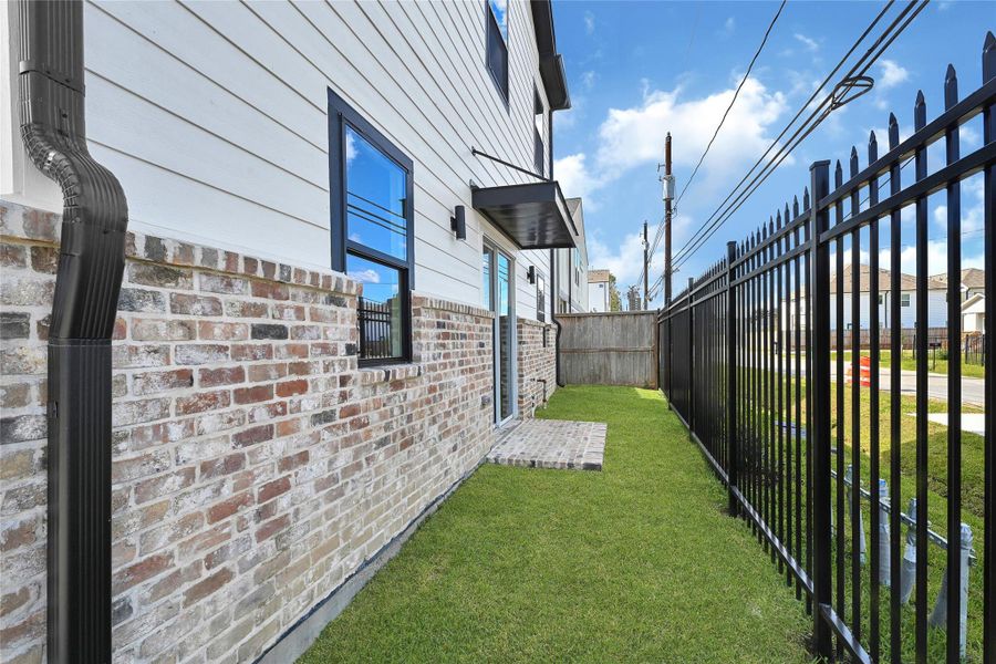 Exterior details and patio area of a home in , Houston (Image 3). Exterior details and patio area of a home in , Houston (Image 3).