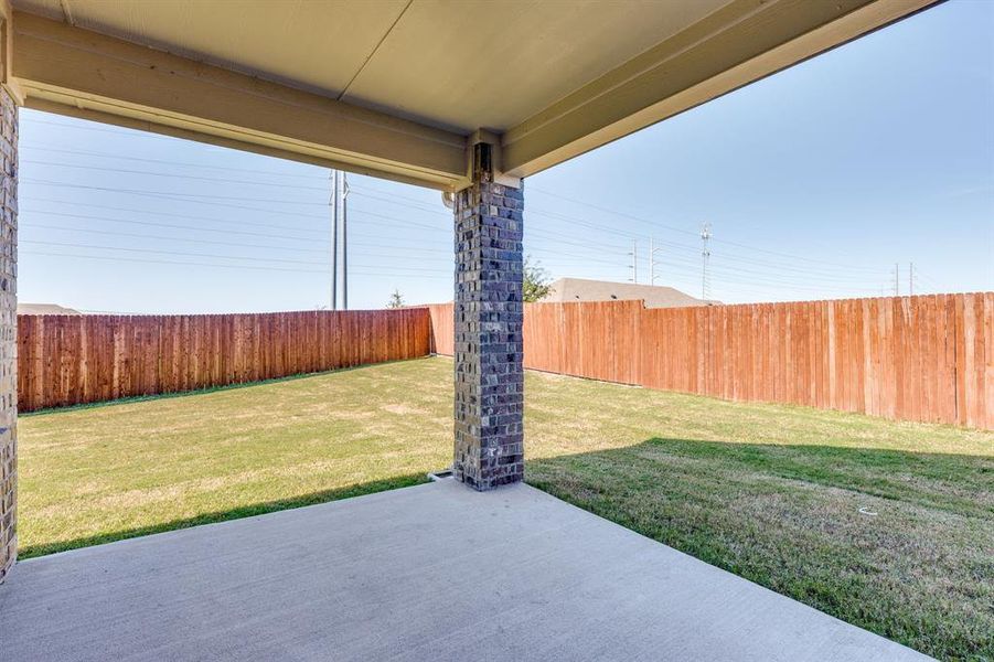 Fenced backyard with a patio Fenced backyard with a patio