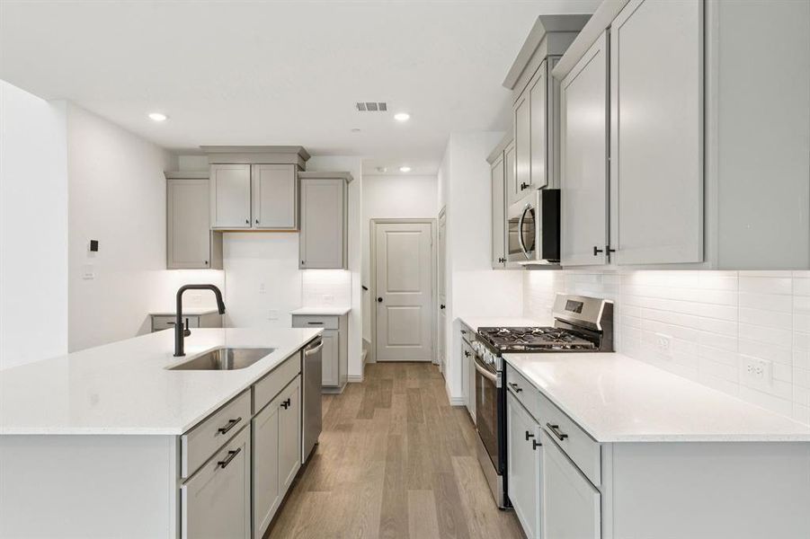 Filled with classic finishes like beautiful cabinetry, gorgeous counter tops and contemporary stainless steel, you'll enjoy this kitchen for years to come!