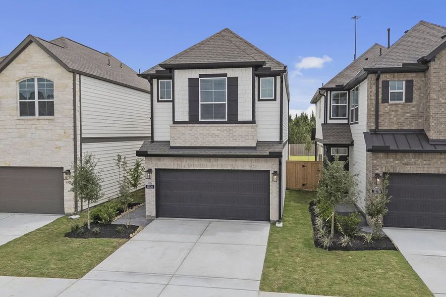 Front exterior of a new home in Bridgeland Chateaus, Cypress, TX, highlighting curb appeal (Image 20).