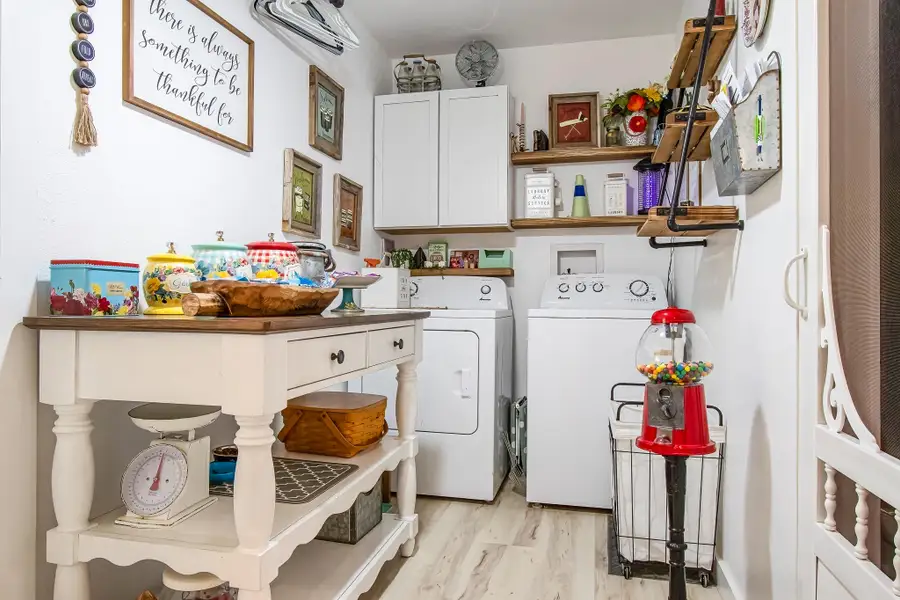 laundry room! A pantry is on the right with the screen door.