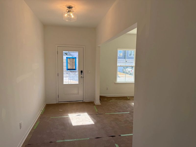Foyer featuring the AW Collection® Coastal - Light floors and airy tones set a relaxed tone.