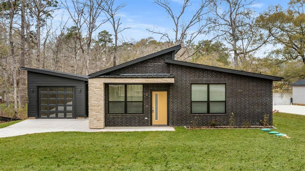 Front exterior of a home in the Frontier Lakes community, located in Willis, TX (Image 2). Front exterior of a home in the Frontier Lakes community, located in Willis, TX (Image 2).