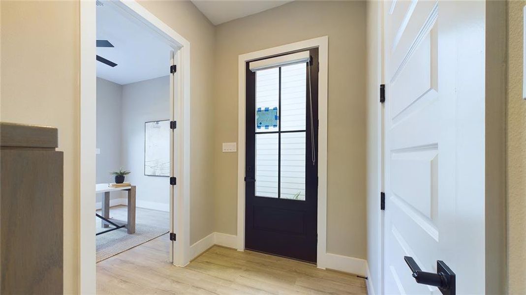 As you enter, you're greeted by a beautifully designed foyer with a stylish modern door and elegant finishes that set the tone for the rest of the home. Every detail is crafted for both aesthetics and function.