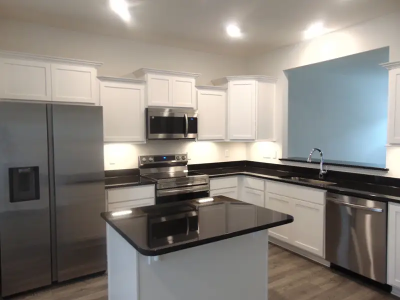 The kitchen is spacious and modern, it comes with steel appliances, and crown cabinetry for a unique look File Photo The kitchen is spacious and modern, it comes with steel appliances, and crown cabinetry for a unique look File Photo