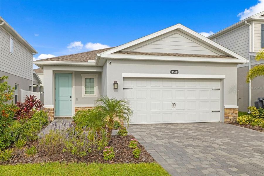 Front exterior of a new home in , Lakewood Ranch, FL, highlighting curb appeal (Image 1).