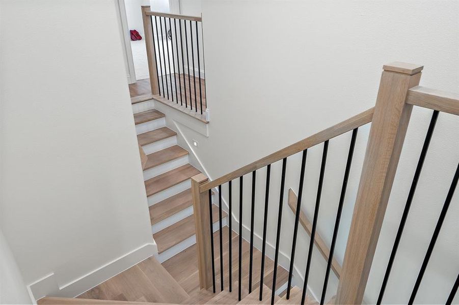 Stairs with wood finished floors and baseboards Stairs with wood finished floors and baseboards