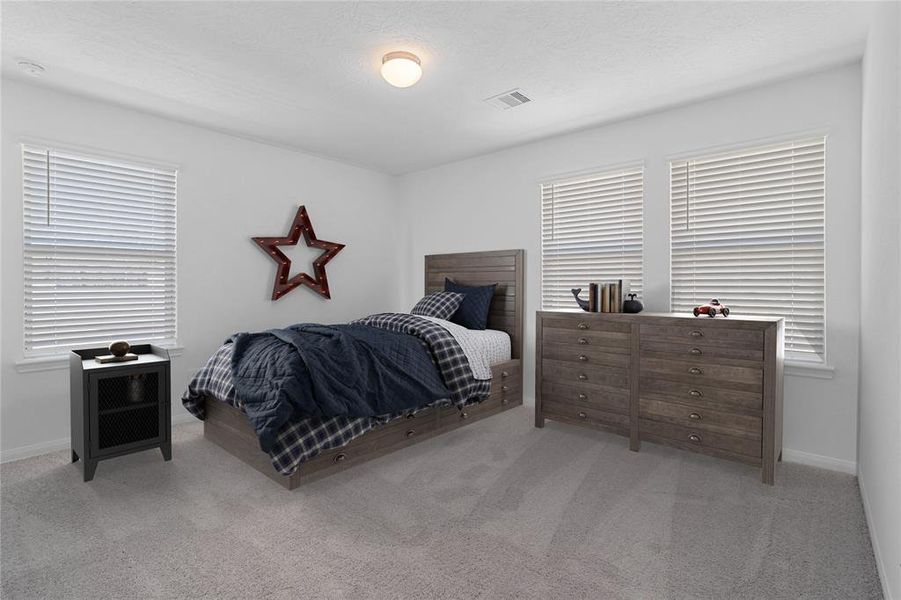 Secondary bedroom features plush carpet, neutral paint, lighting, large window with privacy blinds and ample sized closet space.