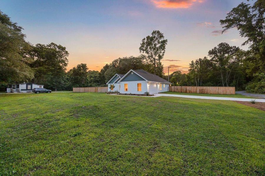 Exterior details and patio area of a home in , Awendaw (Image 38).