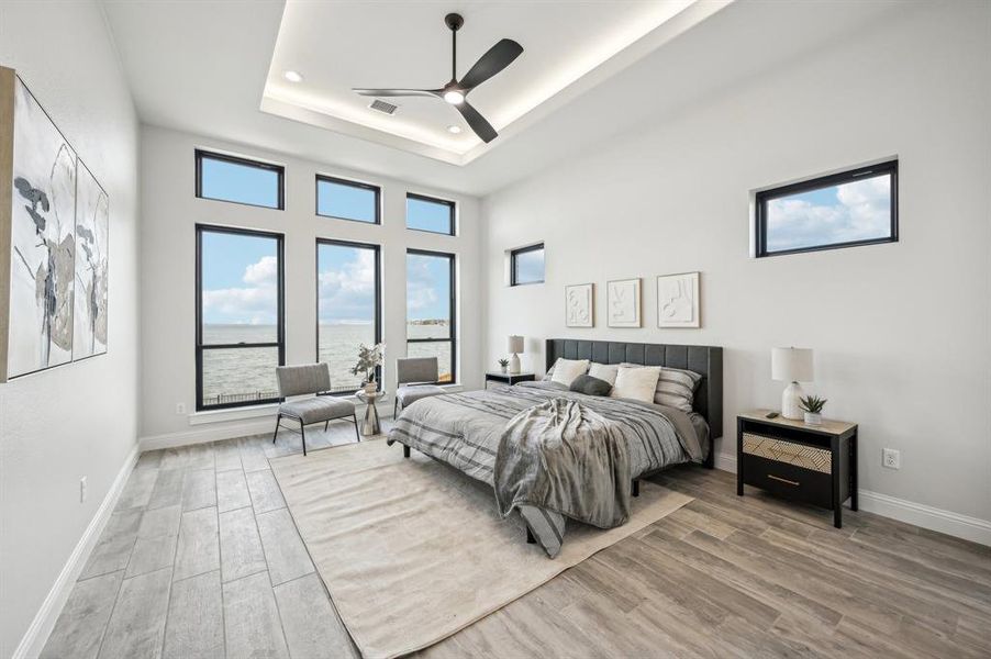 Well appointed primary bedroom over looking expansive Lake Ray Hubbard waterfront views. (Bedroom 1 of 5)