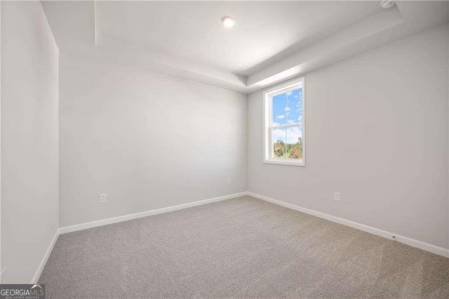 Spacious, unfurnished interior of a new home in The Paddocks at Doc Hughes, Buford (Image 26).