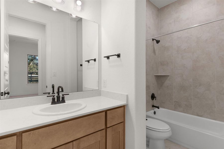 Bathroom with vanity and shower / bathtub combination