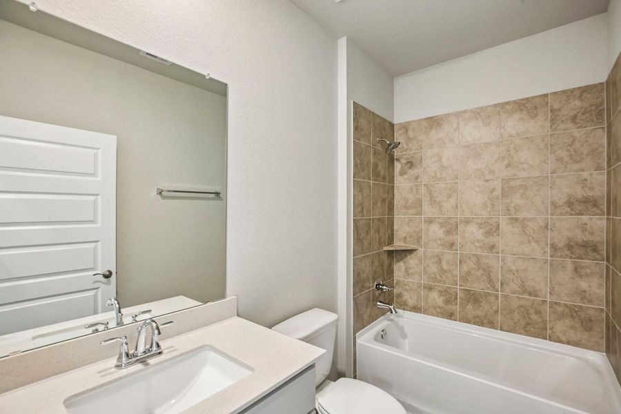 A practical bathroom layout provides comfort and convenience for family members and guests.
