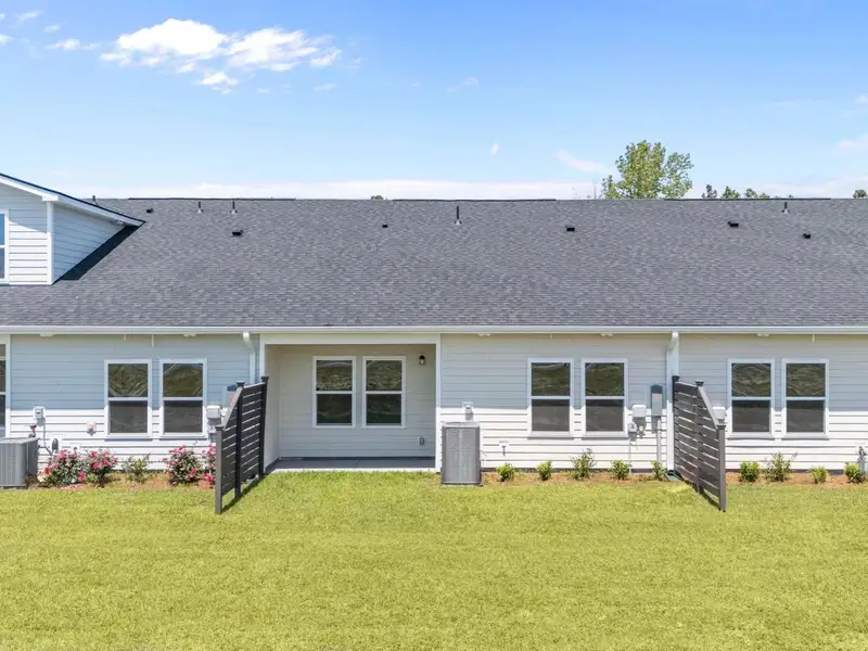 Exterior details and patio area of a home in Blue Heron Retreat, Little River (Image 4).