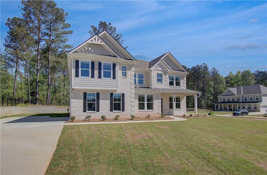 Front exterior of a new home in Trinity Park, McDonough, GA, highlighting curb appeal (Image 22).