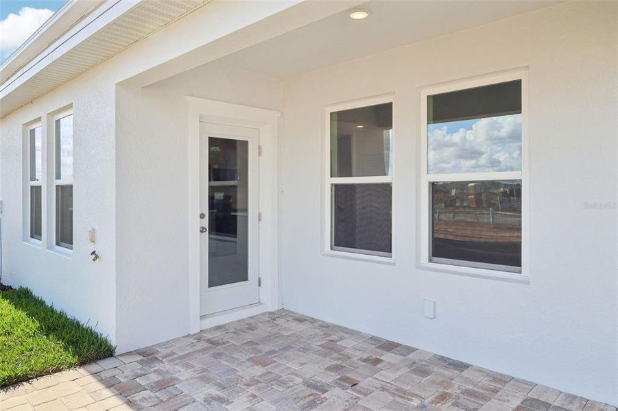 Exterior details and patio area of a home in Cyrene at Harmony, St. Cloud (Image 21).