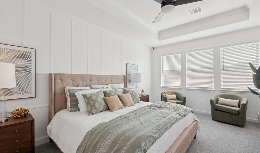 Primary suite with decorative feature wall