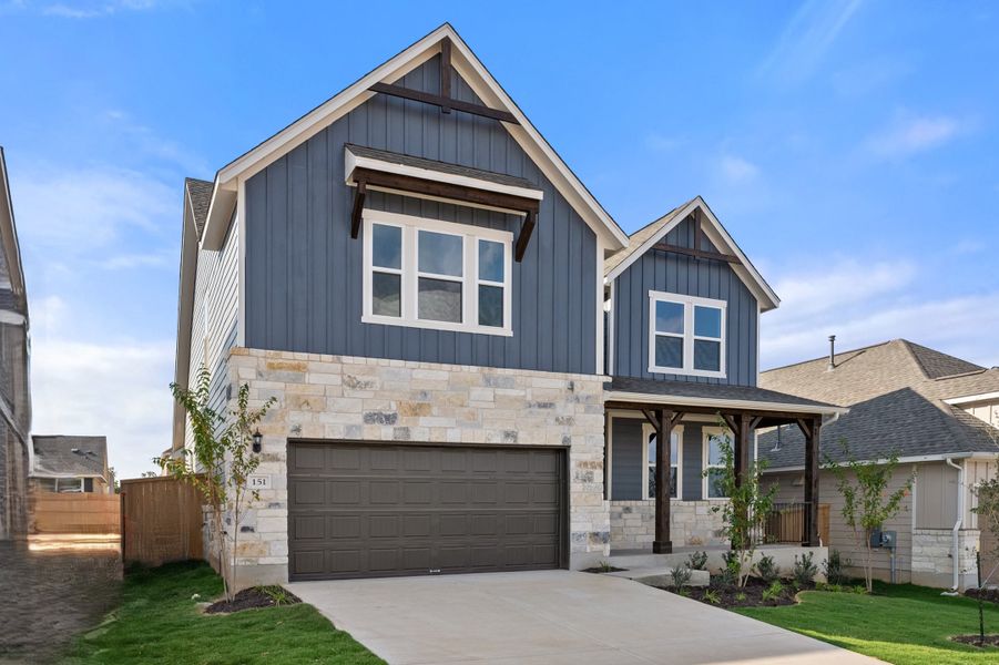 Representative exterior photo of a completed home built from the Somerville by Ashton Woods in Willow Springs, Buda, TX (Image 22).