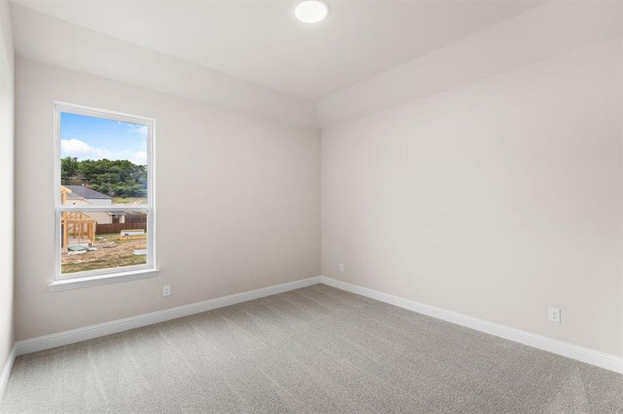 Empty room with carpet flooring