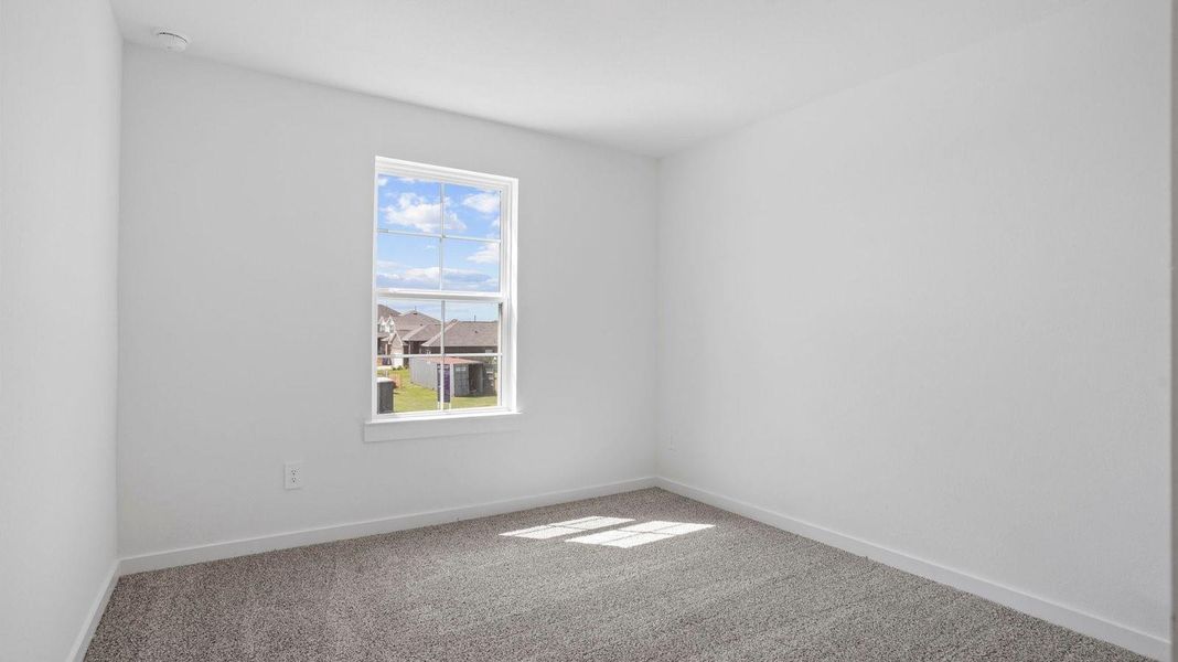 Spacious, unfurnished interior of a new home in Caldwell Crossing, Iowa Colony (Image 17).