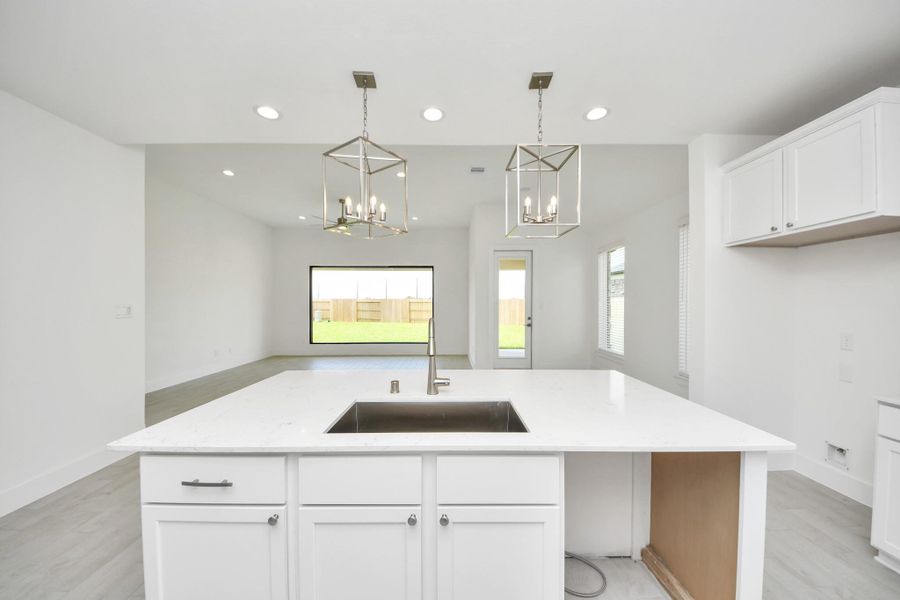 All of this overlooks your expansive family room, creating a perfect space for culinary delights and family gatherings.