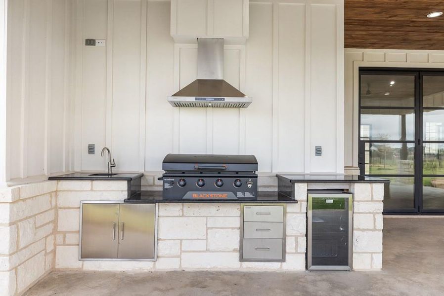 View of patio with wine cooler and area for grilling View of patio with wine cooler and area for grilling