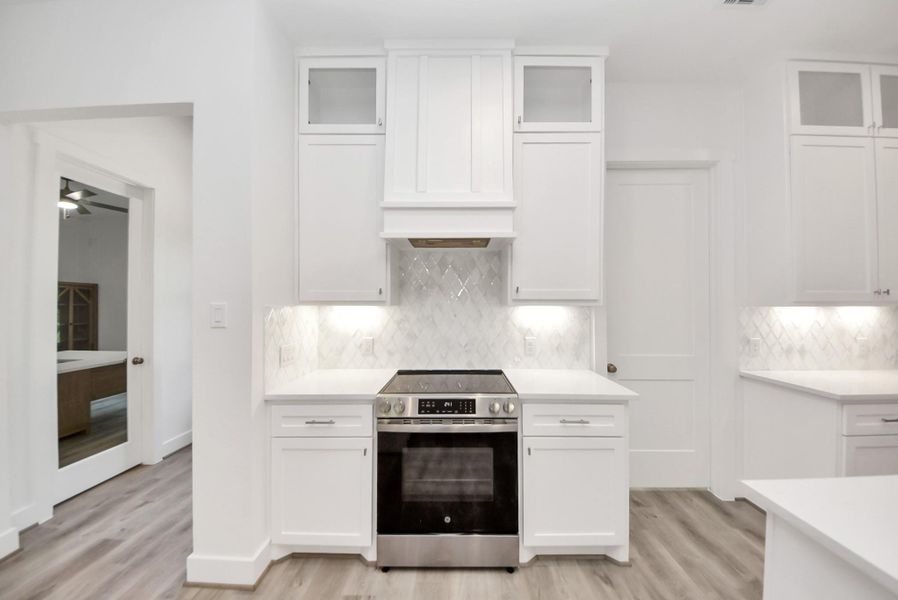 Kitchen view highlighting sleek cabinetry and functional design.
