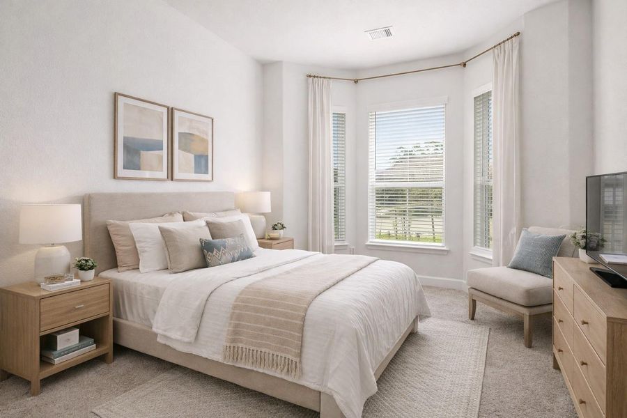 Inviting downstairs bedroom with elegant staging and abundant natural light. Inviting downstairs bedroom with elegant staging and abundant natural light.