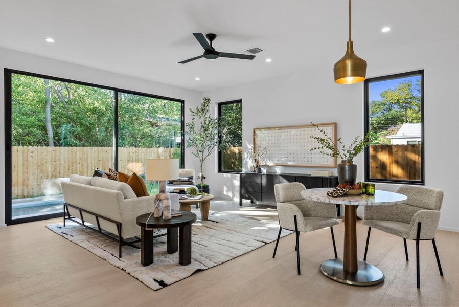 Living area featuring a large sliding door to the pool, deck and garden, abundant natural light, custom finishes. Living area featuring a large sliding door to the pool, deck and garden, abundant natural light, custom finishes.