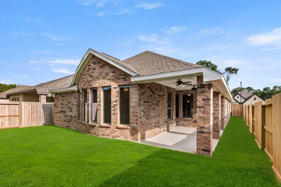 Front exterior of a new home in The Highlands 45', Porter, TX, highlighting curb appeal (Image 1).