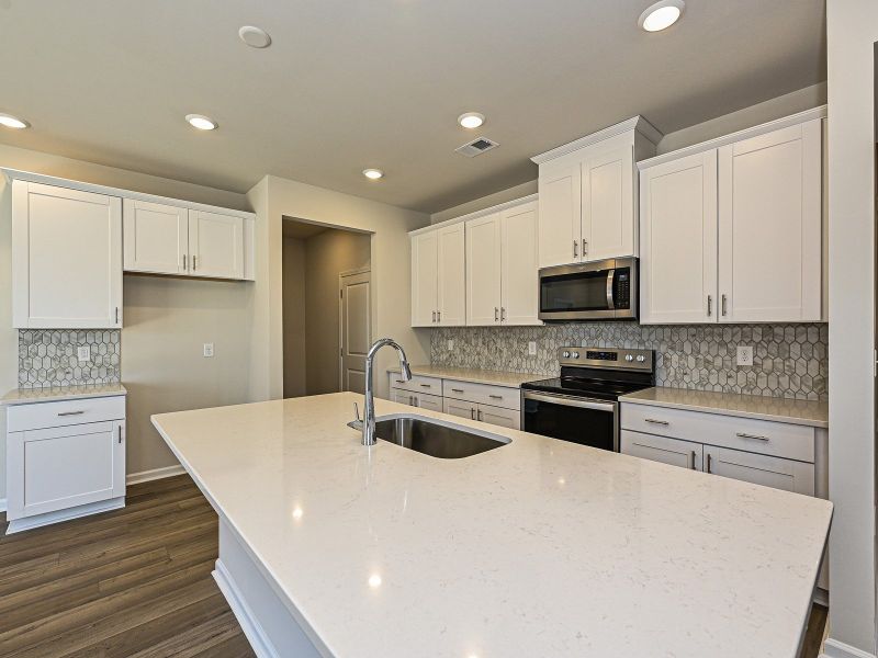 Meal-prepping just got easier with oversized counters and countless kitchen cabinets.