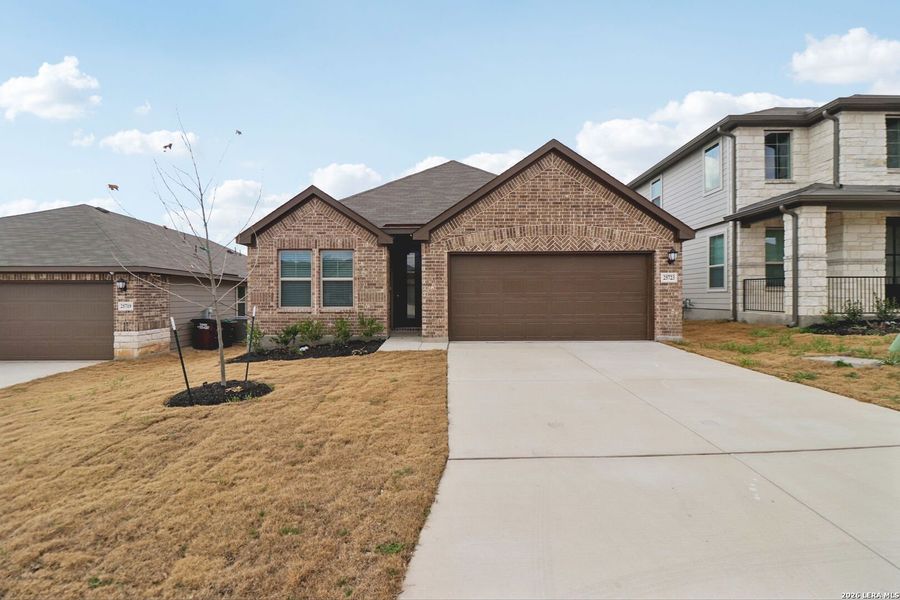 Front exterior of a new home in Scenic Crest - Premier Series, Boerne, TX, highlighting curb appeal (Image 26).