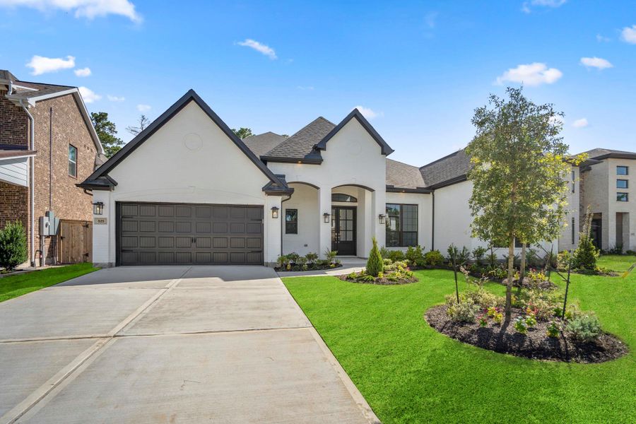 Front exterior of a new home in , Conroe, TX, highlighting curb appeal (Image 4).