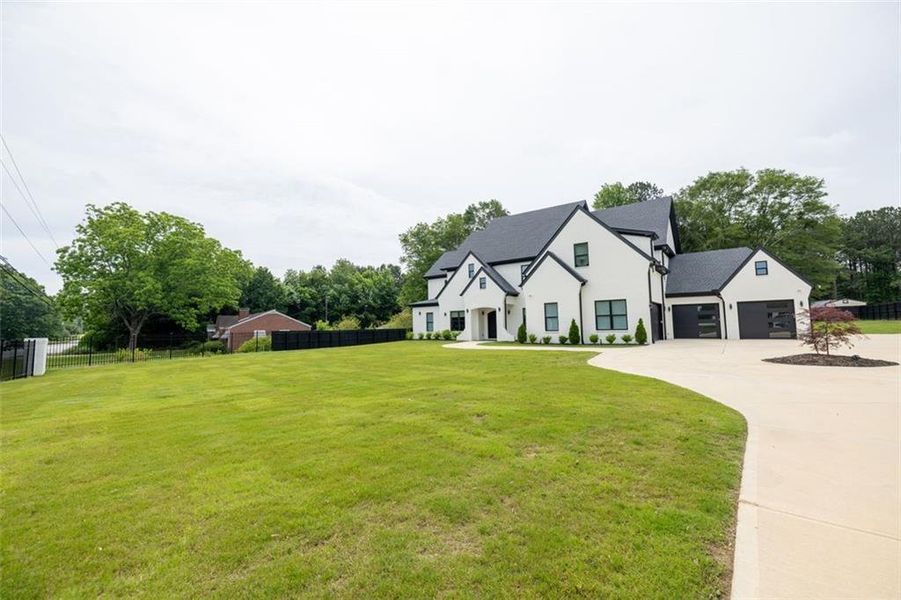 Front exterior of a new home in , Buford, GA, highlighting curb appeal (Image 26).