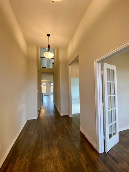Elegant entry welcomes you with rich handscraped wood floors