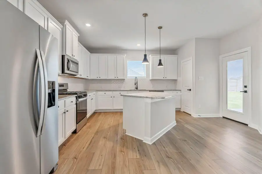 The kitchen comes fully fitted with stainless-steel, Whirlpool kitchen appliances.