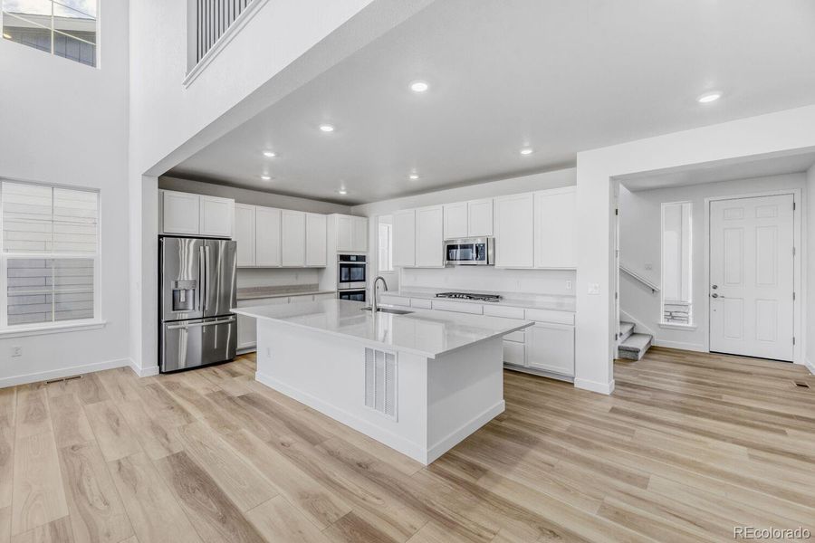 Furnished interior view inside a new home in Macanta: The Grand Collection, Castle Rock (Image 5).