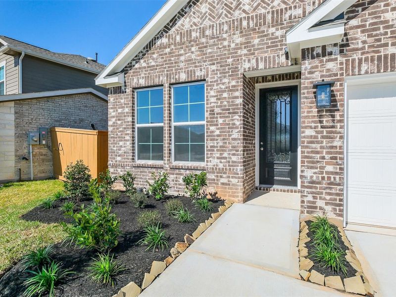 Exterior details and patio area of a home in Sunterra, Katy (Image 3).