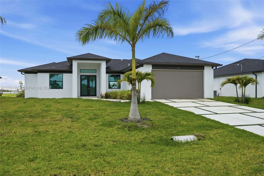 Front exterior of a new home in , Cape Coral, FL, highlighting curb appeal (Image 1). Front exterior of a new home in , Cape Coral, FL, highlighting curb appeal (Image 1).