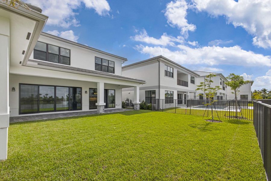 Front exterior of a new home in Apex at Avenir, Palm Beach Gardens, FL, highlighting curb appeal (Image 27).
