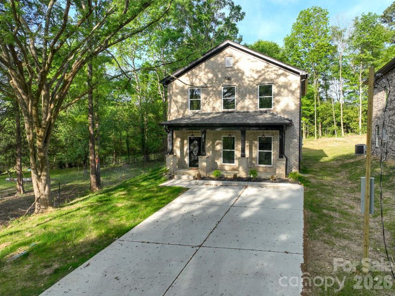 Front exterior of a new home in , Albemarle, NC, highlighting curb appeal (Image 22).