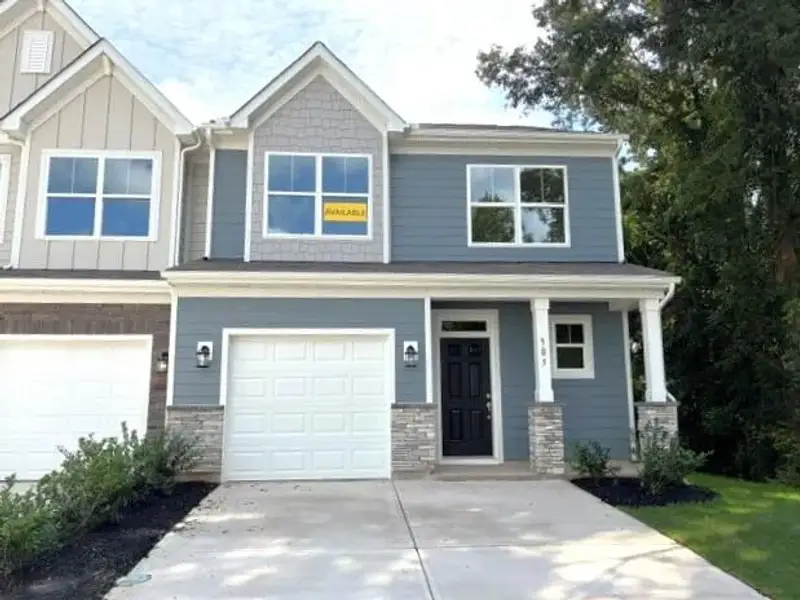 Front exterior of a new home in Riverbrooke Townhomes, Simpsonville, SC, highlighting curb appeal (Image 1). Front exterior of a new home in Riverbrooke Townhomes, Simpsonville, SC, highlighting curb appeal (Image 1).