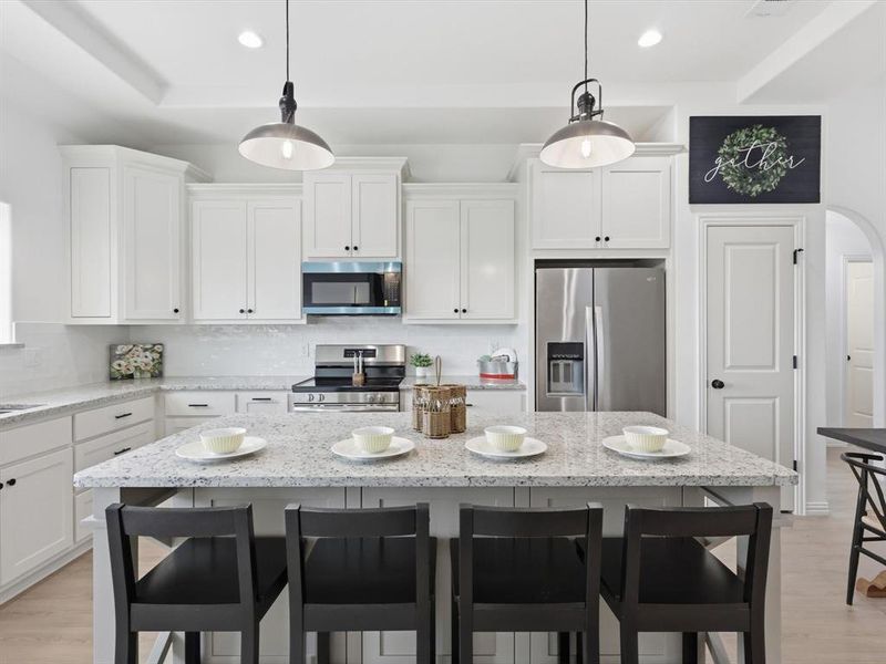 Plenty of storage in this beautiful kitchen with ample cabinet space along with a walk in pantry.