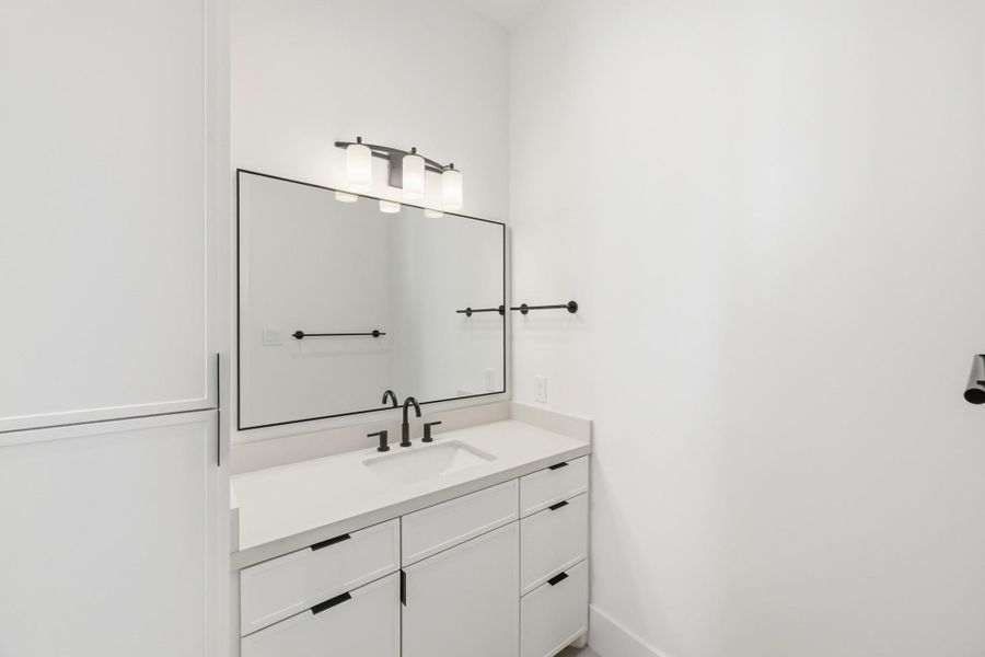 With bold tile, the vanity space is kept minimalist on purpose!