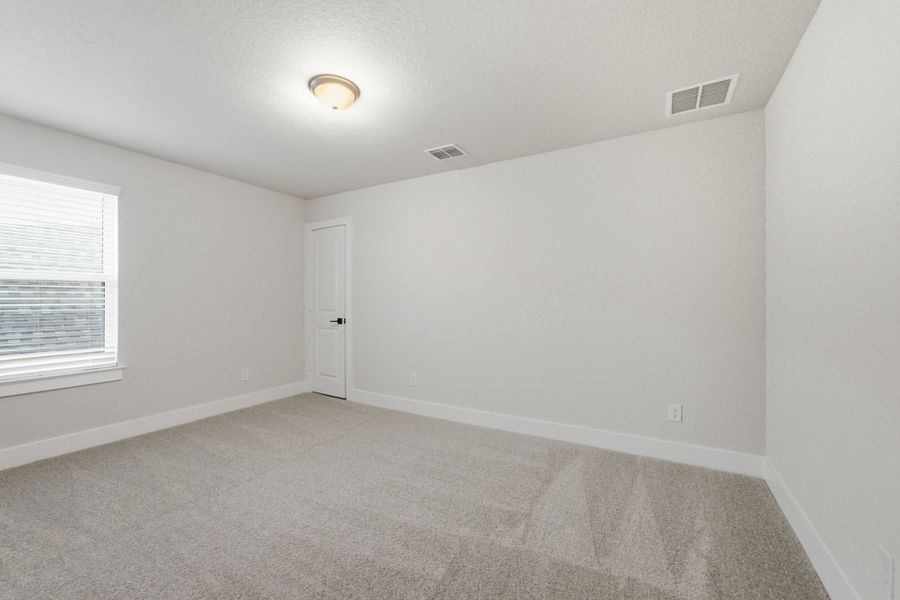 Spacious, unfurnished interior of a new home in The Woodlands at Medina Hills, Mico (Image 38).