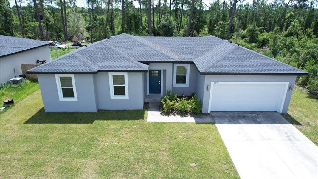 Front exterior of a new home in , Deland, FL, highlighting curb appeal (Image 17). Front exterior of a new home in , Deland, FL, highlighting curb appeal (Image 17).