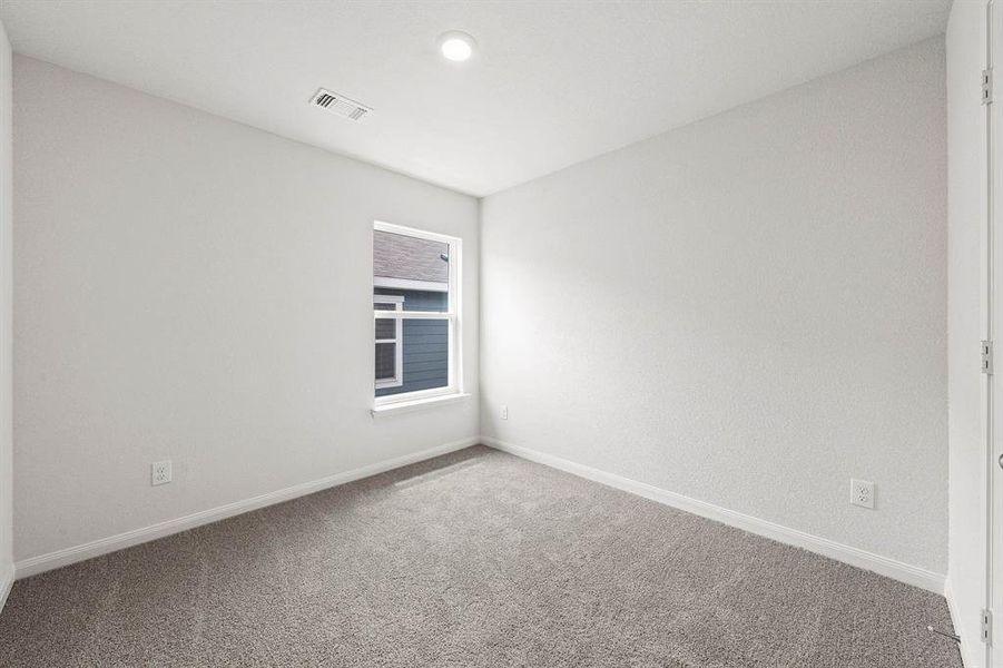 Unfurnished room featuring carpet