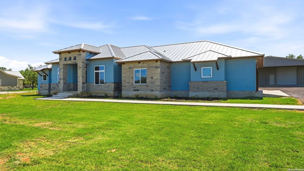 Front exterior of a new home in , Adkins, TX, highlighting curb appeal (Image 25).